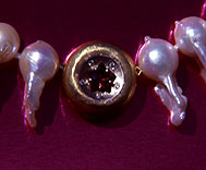 pearl clasp with garnet star and diamonds