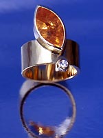 ring with imperial topaz and diamond