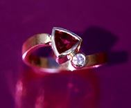 wavy ring with rhodolite triangle and diamond