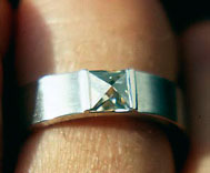 Platinum ring with diamond in context cut